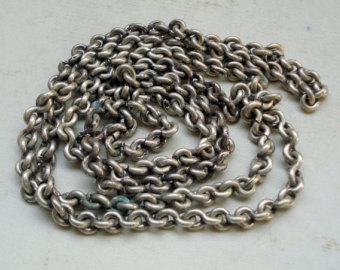 How is the silver chain cleaned at home?